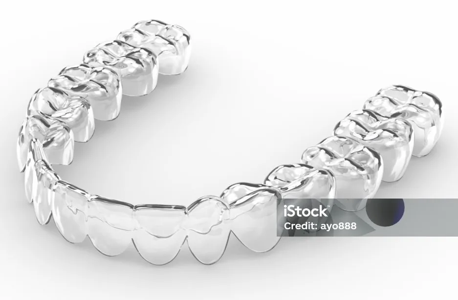 A clear, removable orthodontic aligner